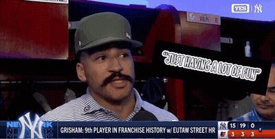 A Man With A Mustache Is Being Interviewed On A Tv Screen GIF