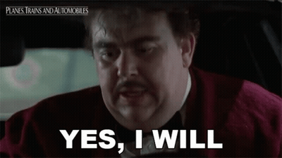 A Man With A Mustache Is Driving A Car And Says `` Yes , I Will '' . GIF