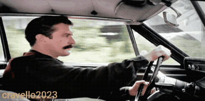 A Man With A Mustache Is Driving A Car In A Photo Taken By Cravello20203 GIF