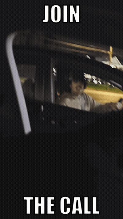 A Man With A Mustache Is Driving A Car With The Words Join The Call Below Him GIF