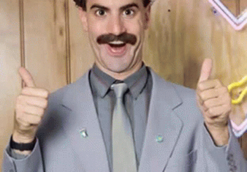 A Man With A Mustache Is Giving Two Thumbs Up GIF