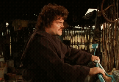A Man With A Mustache Is Holding A Bicycle In His Hands GIF