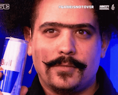 A Man With A Mustache Is Holding A Can Of Redbull GIF
