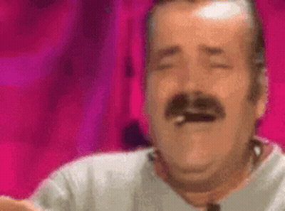 A Man With A Mustache Is Laughing With His Eyes Closed And Smoking A Cigarette . GIF