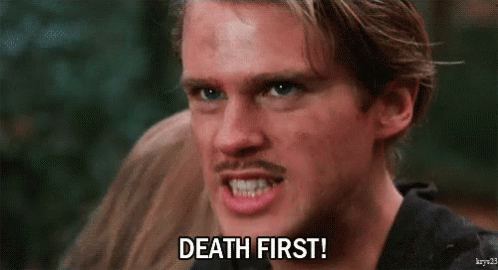 A Man With A Mustache Is Making A Face And Saying Death First . GIF