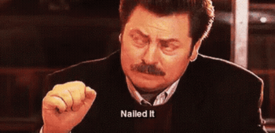 A Man With A Mustache Is Making A Funny Face And Pointing At The Camera . GIF