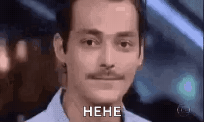A Man With A Mustache Is Making A Funny Face And Saying , `` Heh '' . GIF