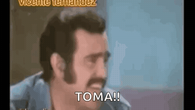 A Man With A Mustache Is Making A Funny Face And Says `` Toma '' . GIF