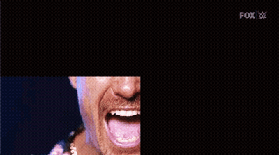 A Man With A Mustache Is Making A Funny Face With His Mouth Open GIF