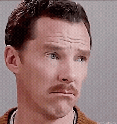 A Man With A Mustache Is Making A Sad Face . GIF