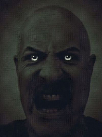 A Man With A Mustache Is Making A Very Angry Face GIF