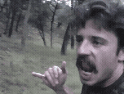 A Man With A Mustache Is Pointing His Finger GIF