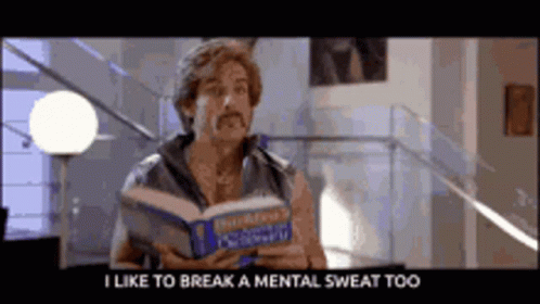 A Man With A Mustache Is Reading A Book And Says " I Like To Break A Mental Sweat Too " GIF
