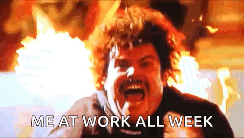 A Man With A Mustache Is Screaming In Front Of A Fire With The Words `` Me At Work All Week '' Written Below Him . GIF
