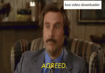 A Man With A Mustache Is Sitting In A Chair With His Eyes Closed And Says Agreed GIF