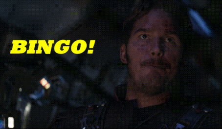 A Man With A Mustache Is Sitting In Front Of A Bingo Sign GIF