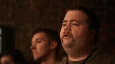A Man With A Mustache Is Sitting In Front Of A Group Of People And Says This Isn 'T Going To End Well GIF
