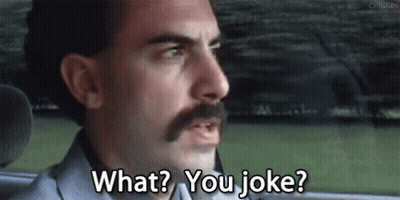 A Man With A Mustache Is Sitting In The Back Seat Of A Car . GIF