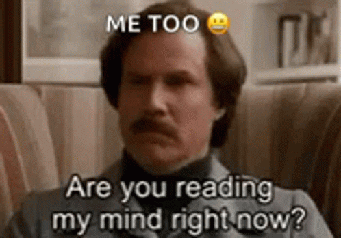 A Man With A Mustache Is Sitting On A Couch . GIF