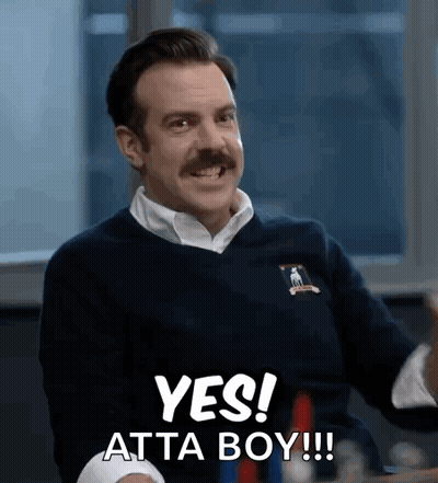A Man With A Mustache Is Smiling And Saying Yes ! Atta Boy !!! GIF