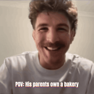 A Man With A Mustache Is Smiling With The Caption " Pov : His Parents Own A Bakery " Above Him GIF