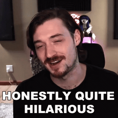 A Man With A Mustache Is Smiling With The Words Honestly Quite Hilarious Below Him GIF