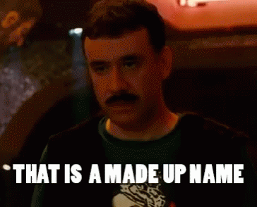 Mustached Man In Dark Room Saying That Is A Made Up Name GIF