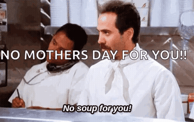 A Man With A Mustache Is Standing In A Kitchen Talking On A Phone And Says `` No Mothers Day For You ! '' GIF