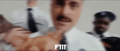 A Man With A Mustache Is Standing In Front Of A Group Of Police Officers And Says Ptit GIF