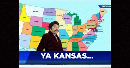 A Man With A Mustache Is Standing In Front Of A Map Of The United States And The Words Ya Kansas GIF
