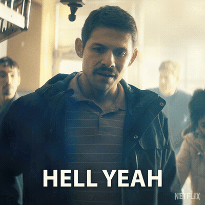 A Man With A Mustache Is Standing In Front Of A Sign That Says " Hell Yeah " GIF