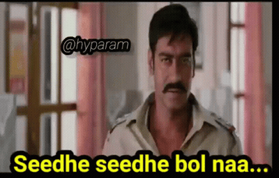 A Man With A Mustache Is Standing In Front Of A Window With A Caption That Says Seedhe Seedhe Bol Naa . GIF