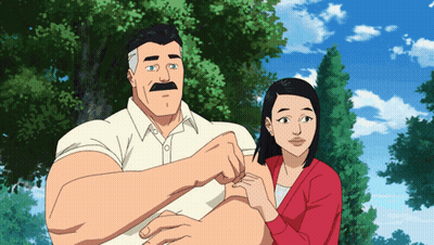 A Man With A Mustache Is Standing Next To A Woman In A Red Sweater GIF