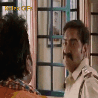 A Man With A Mustache Is Standing Next To Another Man In A Room . GIF