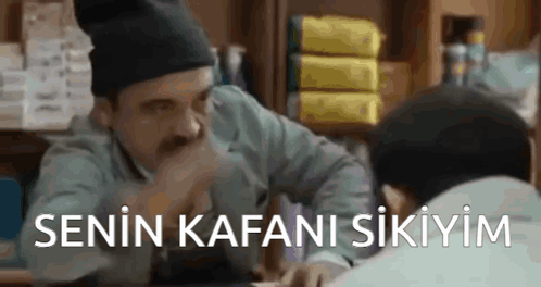 A Man With A Mustache Is Talking To Another Man In A Store While Wearing A Hat . GIF