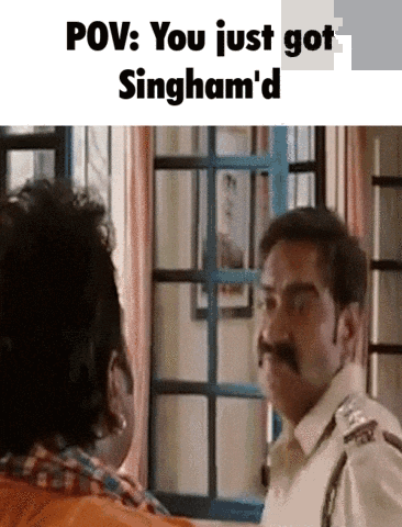 A Man With A Mustache Is Talking To Another Man In Front Of A Window In A Room . GIF