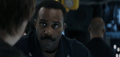 A Man With A Mustache Is Talking To Another Man With The Words " You 'Ve Come To The Right Man " Above Him GIF