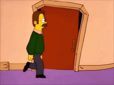 A Man With A Mustache Is Walking Through A Door . GIF