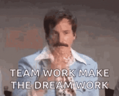 A Man With A Mustache Is Wearing A Blue Shirt And A Blue Jacket And Says `` Team Work Make The Dream Work '' . GIF