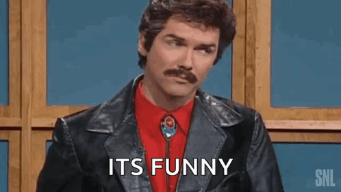 A Man With A Mustache Is Wearing A Leather Jacket And A Red Shirt And Tie And Says `` Its Funny '' . GIF
