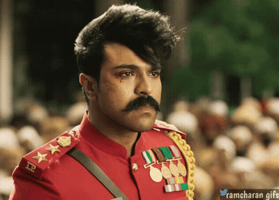 A Man With A Mustache Is Wearing A Red Uniform With Medals On The Sleeves GIF