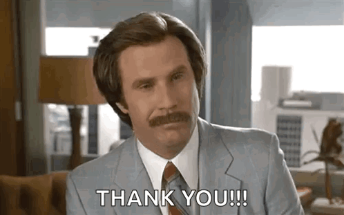 A Man With A Mustache Is Wearing A Suit And Tie And Saying `` Thank You '' . GIF