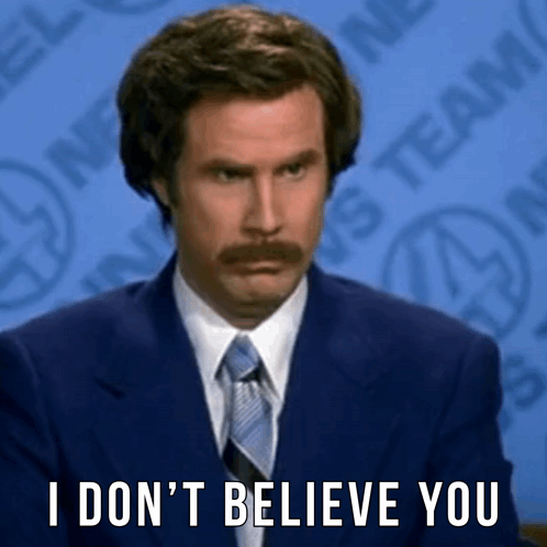 A Man With A Mustache Is Wearing A Suit And Tie And Says `` I Don T Believe You '' . GIF