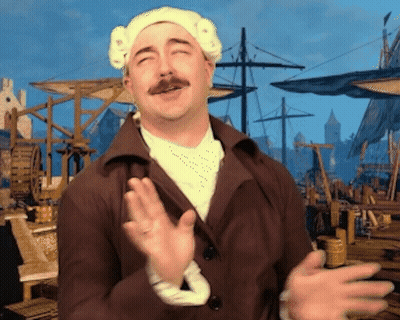 A Man With A Mustache Is Wearing A White Hat And A Brown Coat GIF