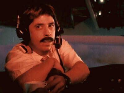 A Man With A Mustache Is Wearing Headphones And A Headset GIF