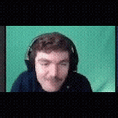 A Man With A Mustache Is Wearing Headphones And Making A Funny Face . GIF