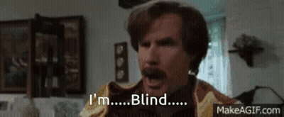 A Man With A Mustache Says I 'M Blind In A Living Room . GIF