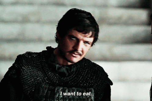 A Man With A Mustache Says " I Want To Eat " While Wearing Chain Mail GIF
