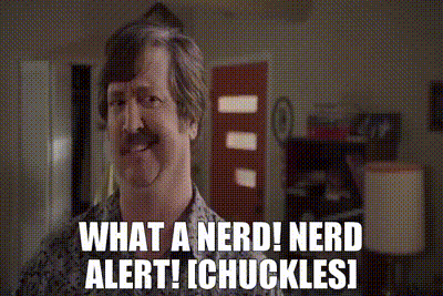 A Man With A Mustache Says " What A Nerd ! Nerd Alert ! Chuckles ! " GIF