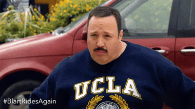 A Man With A Mustache Wearing A Blue Ucla Sweatshirt GIF
